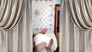 Hot housewife Lukerya. A mature Ukrainian woman shows off her figure and poses for the camera at home.