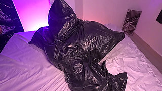 Girl in Garbage Bag Plays with Her Breath