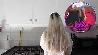 Amazingly beautiful petite blonde hot college girl in her dormitory kitchen getting ready for Christmas Party