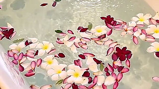 Bath of Blossoms Naked MILF Masturbates Among Flowers