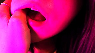 Redheaded pierced teen close up toy show