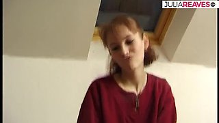 Skinny redhead strips on bed and fingers herself with moaning tits