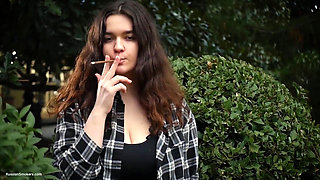 Sweet and Busty Russian Babe Smoking Cigarette in Nature