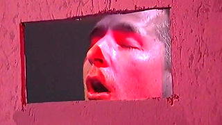 Blonde milf plays with two cocks at glory hole