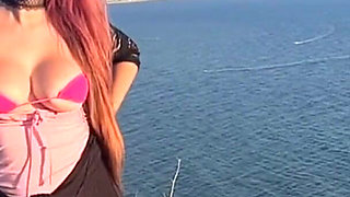 Artemisia Love Wearing Sexy Clothes and Smoking and Flashing Her Big Juicy Boobs in a Perfect Place by the Ocean