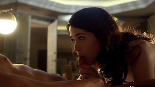 Two guys share a hot interracial threesome with a stunning brunette on the bed