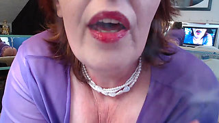 911 Redheaded DawnSkye brings a Smoke and Stroke in purple lace with dildo sucking and riding