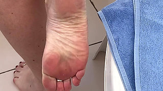 Mrs Mature Feet on the balcony in a very sheer dress