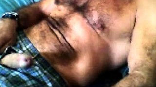 Bearded daddy strokes his cock solo