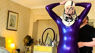 Older amateur mommy wears glasses and latex uniform
