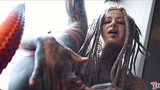 Fabulous tatted damsel pokes her bootie with a enormous fake penis