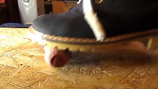 Domina crushes cock with high heels