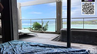 A woman likes a beach look while masturbating
