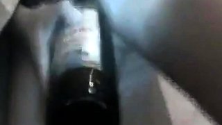 Asian Girl Uses a Bottle to Masturbate