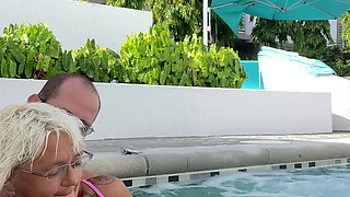 Getting frisky in the hot tub. Boob play.