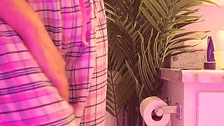 Emily pissing in the bathroom