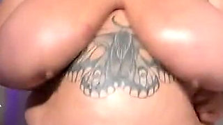 Huge Tits in an Oiled Bikini