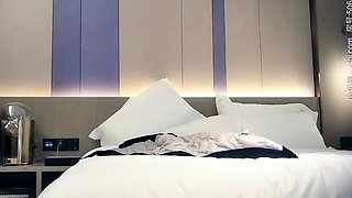 Cute amateur asian web cam girl playing with her toy