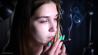 Young Redhead Smoking with Turquoise Nails