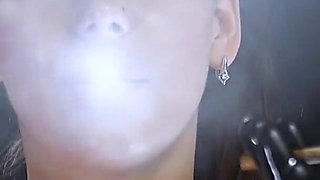 Brunette Smoking in Black Latex Outfit Slow Sensual Scene