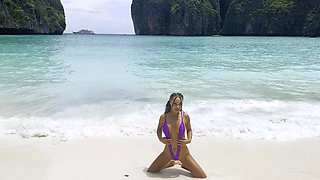 Sexy Monika Fox in Purple Swimsuit on Paradise Island