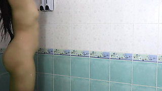 Thai teenager showers, showing off her pink nipples and smooth vagina. Real Thai Solo