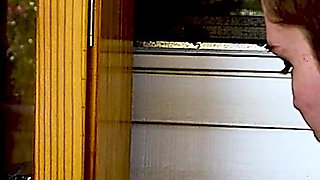 Shaved Head Goth Smokes Outside