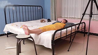 A Cute Barefoot Girlfriend Uses Tape to Bind Her Whole Body, Playing with Her Cute Bare Feet