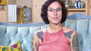 Tattooed dark haired with glasses enjoys hot solo