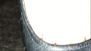 Tattooed Latin woman, black heels plays modeling